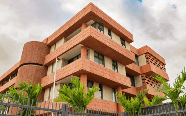 The terraced red-brick building of Wellington College International Pune