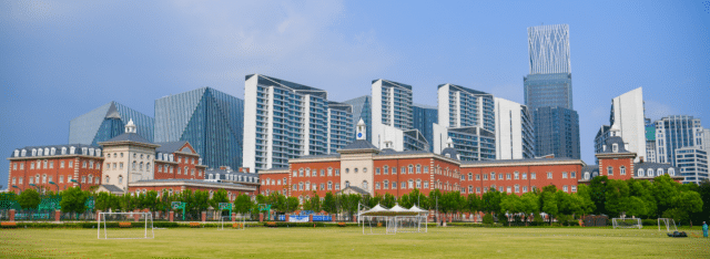 Wellington College International Shanghai campus with the city skyline behind